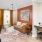 Model living room at our apartments for rent in Peachtree Corners, featuring wood grain floor paneling and a leather couch.