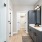 Model bathroom at our apartments in Peachtree Corners, GA, featuring wood grain floor paneling and a walk in closet.