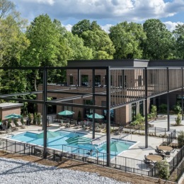 pool area showing reclining seating, wooden coverings and ample space